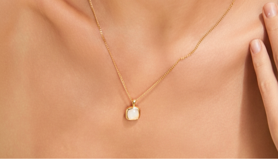 Elegant gold necklace editorial style warm tones